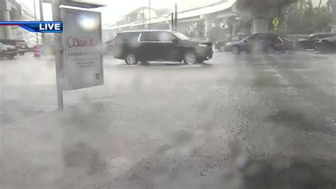 South Florida experiences heavy rains, flooding sending cars floating down Biscayne Blvd.